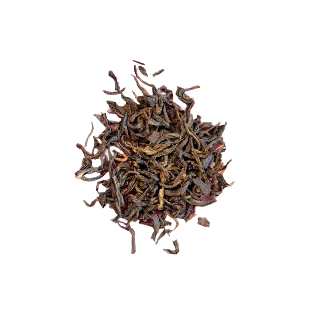 Dry black tea leaves on a white background