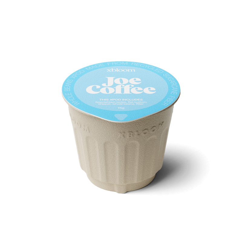 xBloom x Joe Coffee coffee xpod with a blue llid on a white background