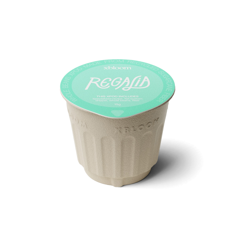 xBloom x Regalia coffee pod with green lid on a white background