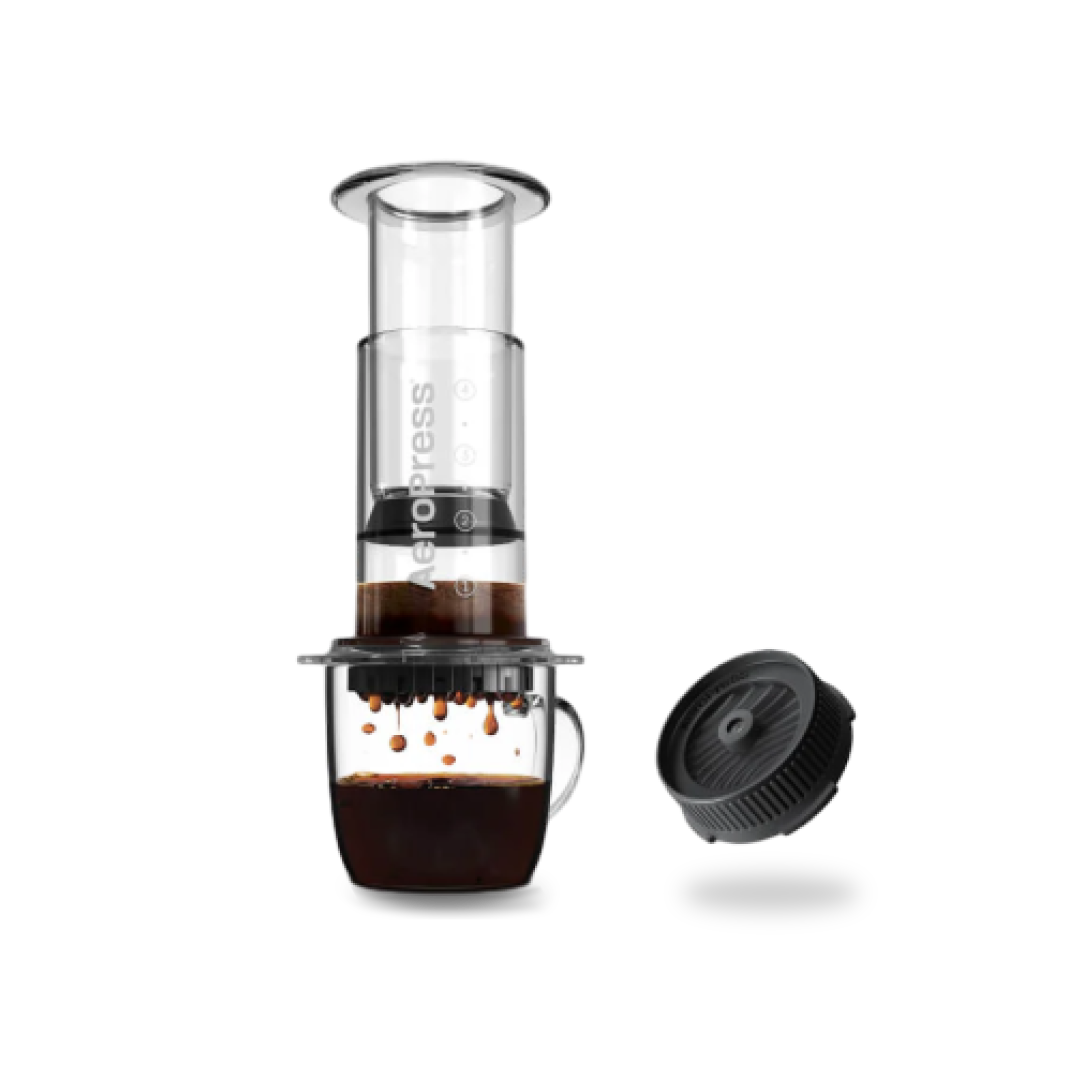AeroPress coffee maker with a clear container and black lid on a white background