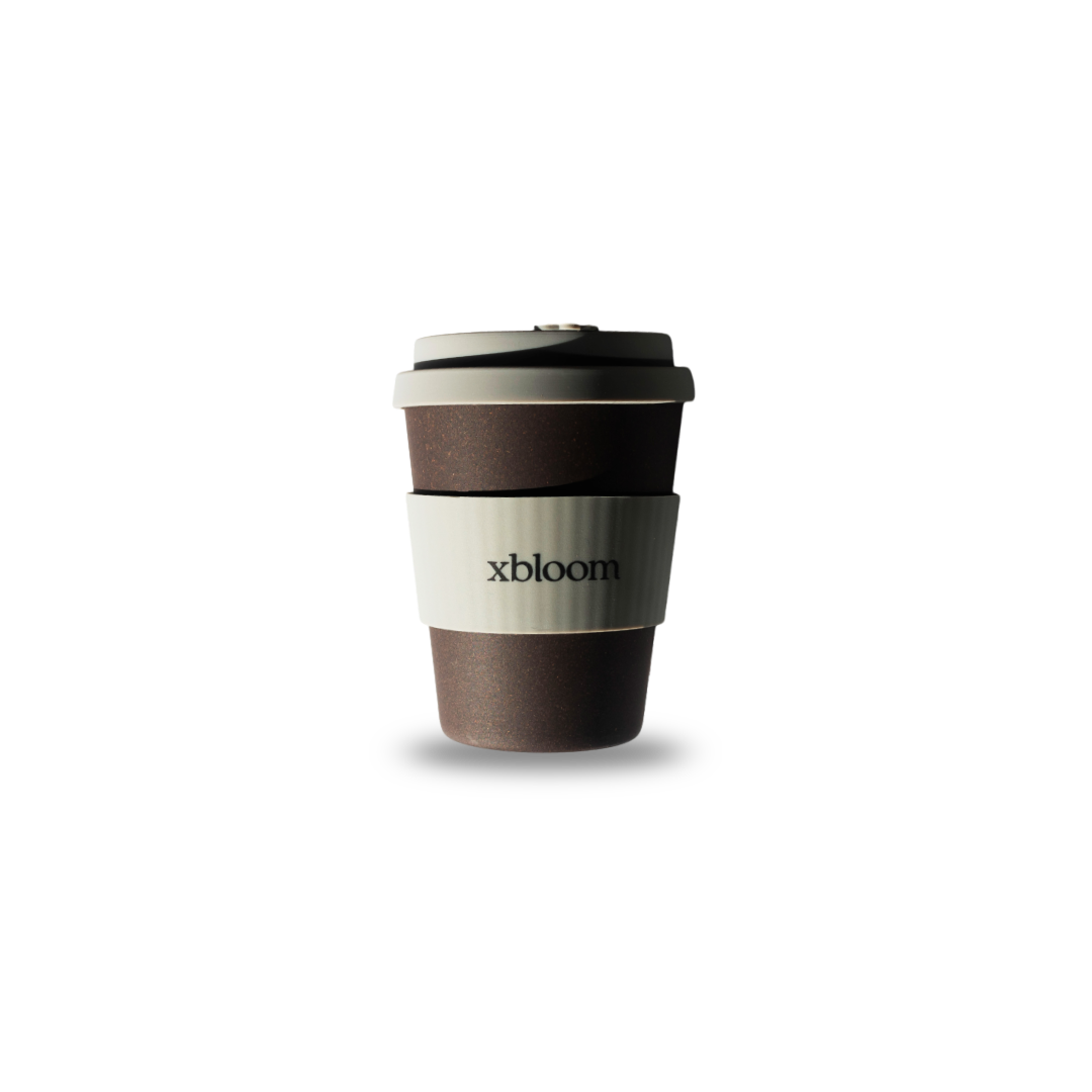 Reusable coffee cup with 'xbloom' branding on a white background