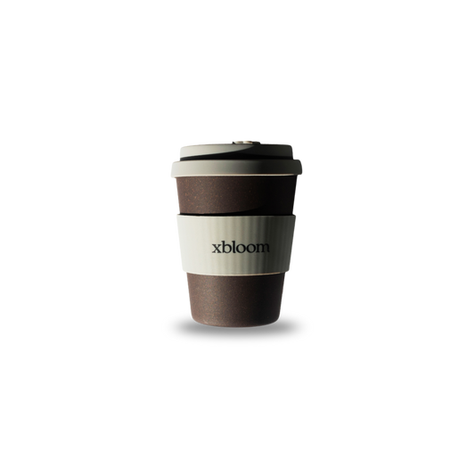 Reusable coffee cup with 'xbloom' branding on a white background