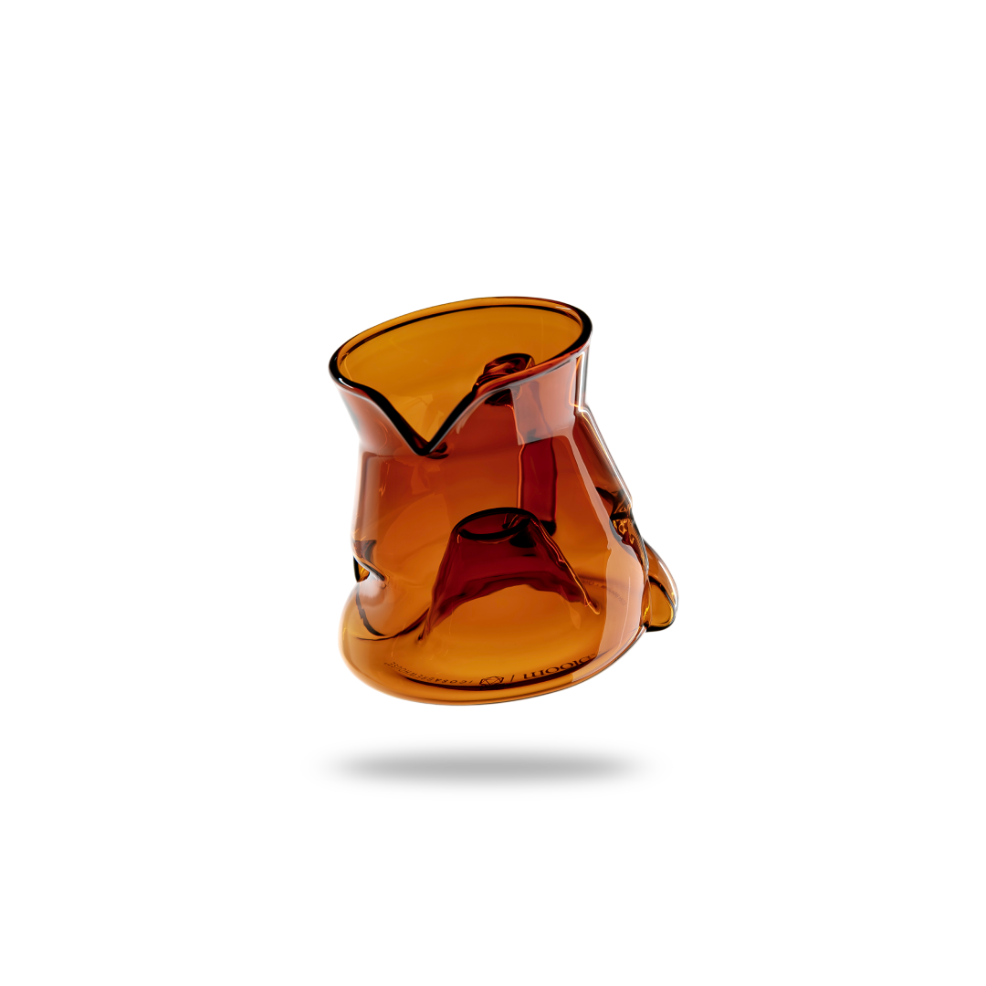 Amber-colored glass object on a white background