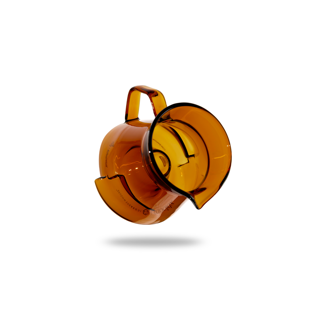 Amber-colored object with a handle on a white background