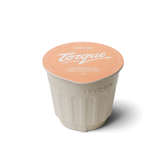 xBloom x Torque Coffee pod on a white background