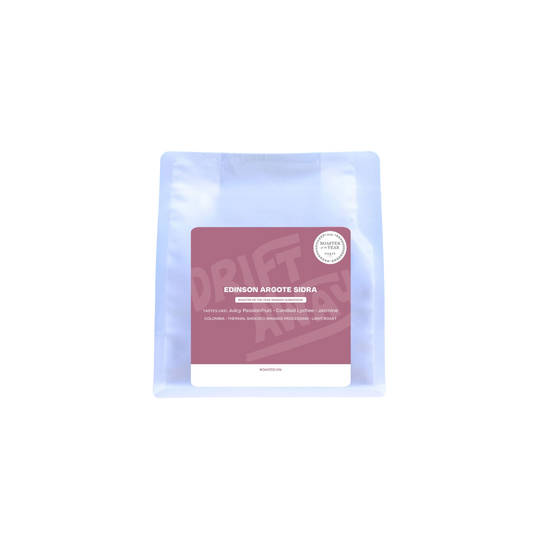 Driftaway coffee packaging with a pink label on a white background.