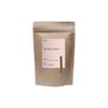 Kraft paper tea bag labeled 'Ginger Lemon' on a white background