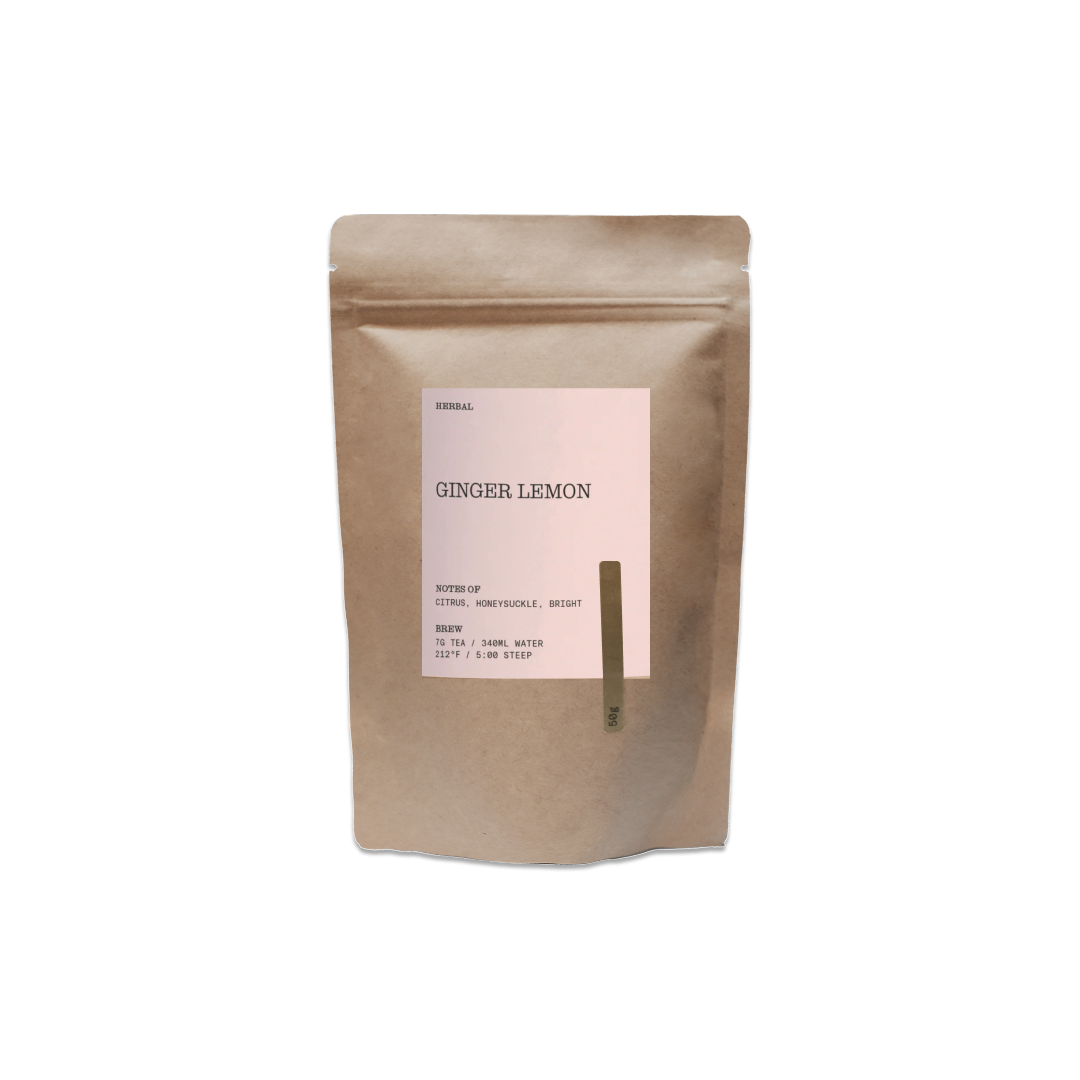 Kraft paper tea bag labeled 'Ginger Lemon' on a white background