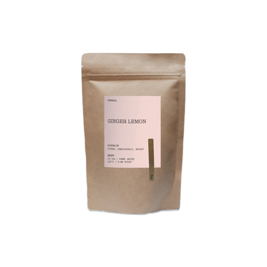 Kraft paper tea bag labeled 'Ginger Lemon' on a white background