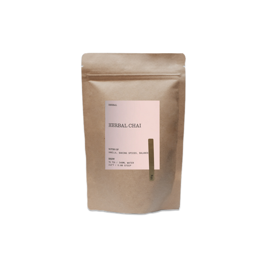 Kraft paper packaging of herbal chai with a label on a white background