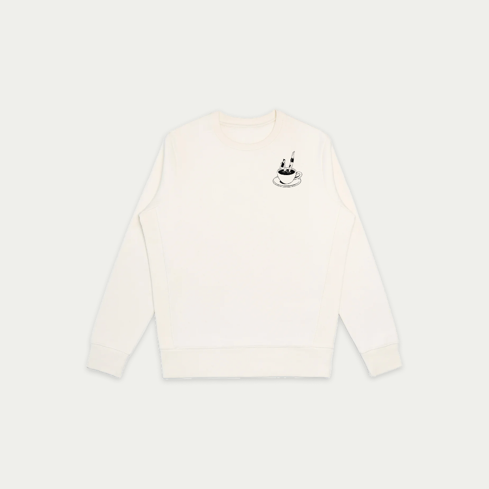 White long-sleeve shirt with a small black graphic on a light gray background