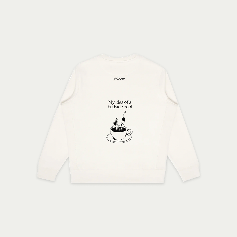 White long-sleeve shirt with black graphic and text on a white background