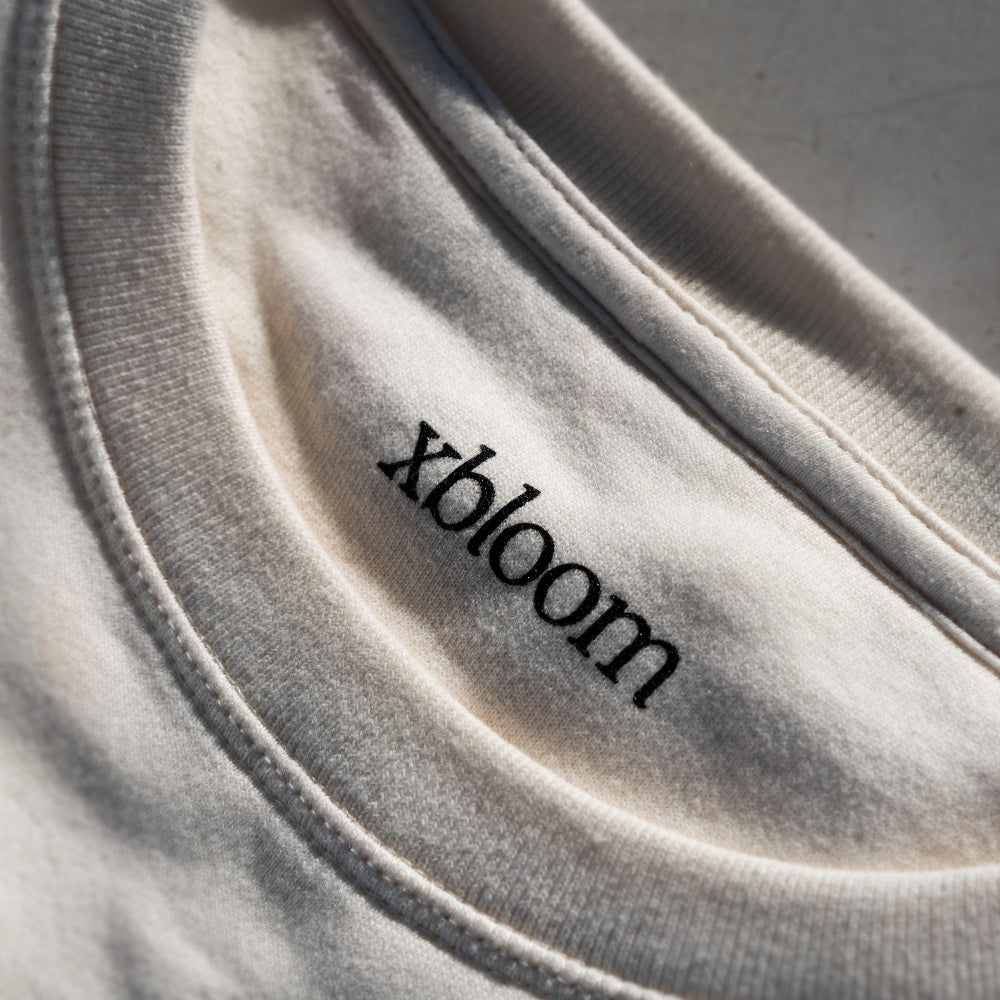 Close-up of a beige fabric with 'xbloom' branding.