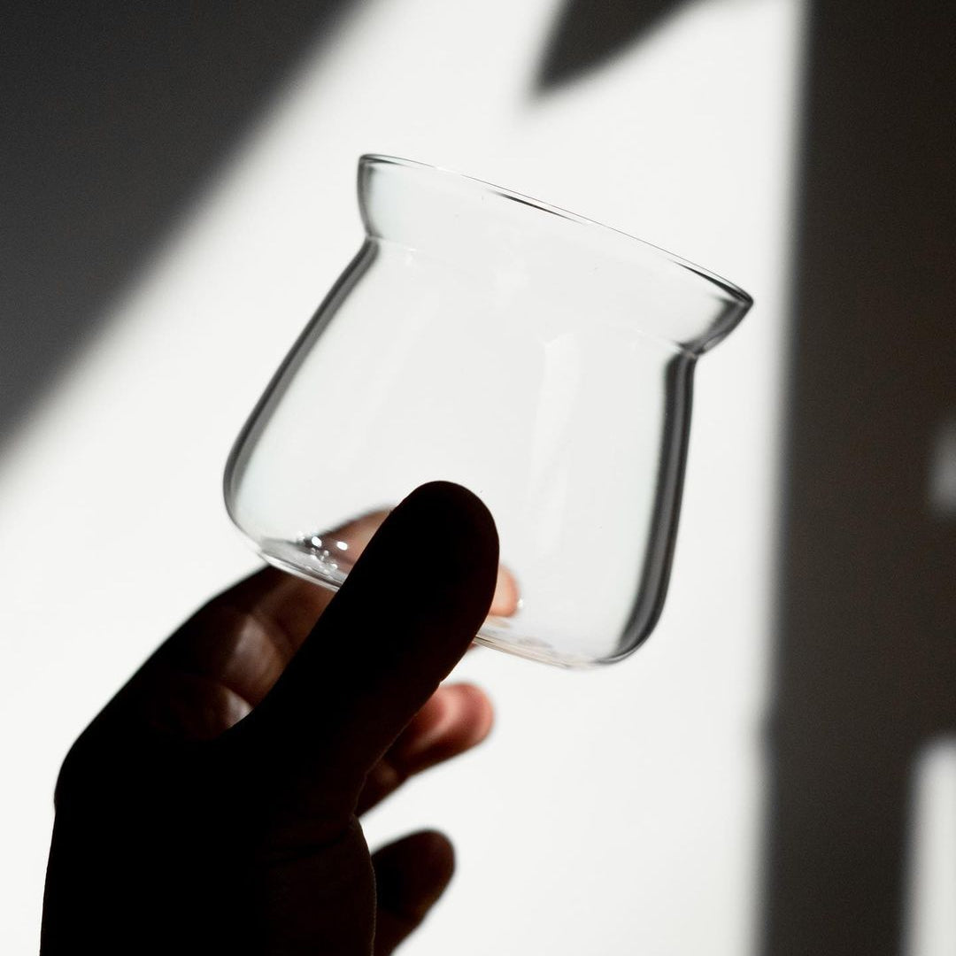 A clear glass designed with a rounded shape, suitable for coffee brewing.