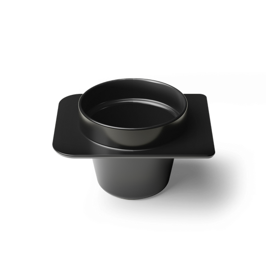 Black plastic component on a white background