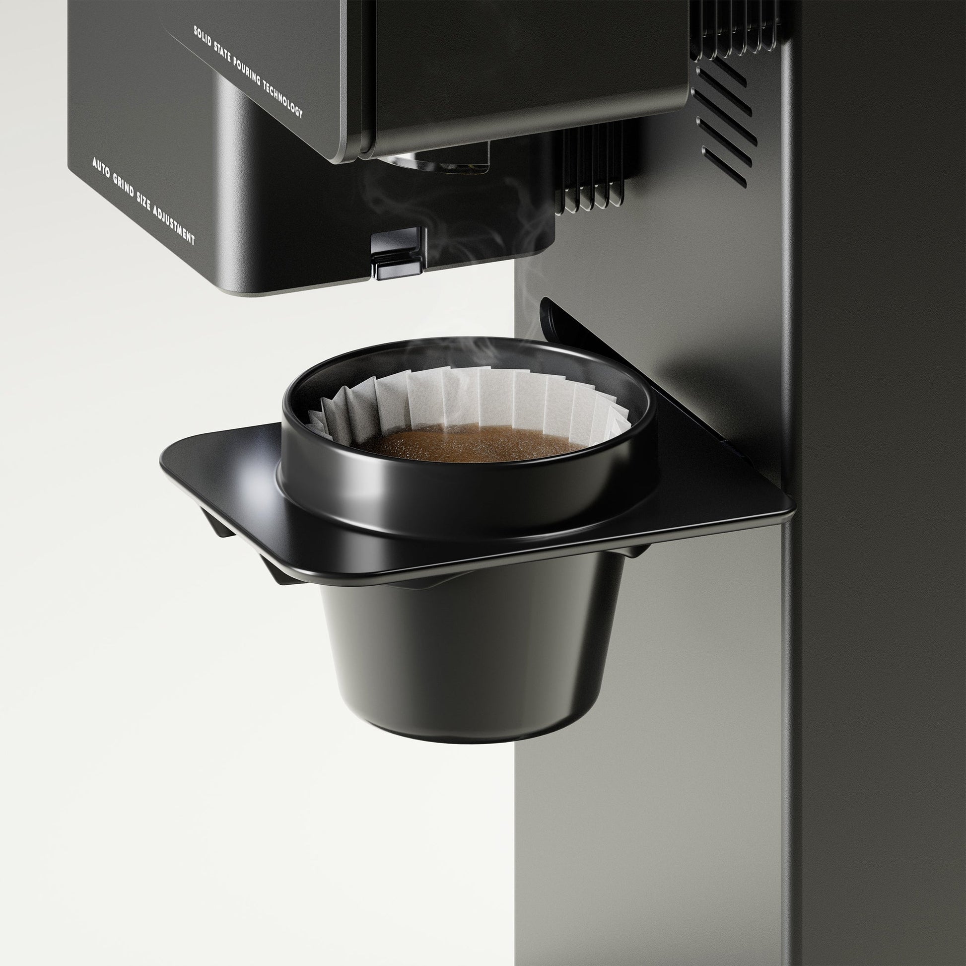 xbloom Original with a black omni dripper, brewing coffee with a paper filter.