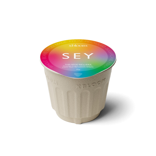 xBloom x SEY coffee xPod with colorful lid on a white background