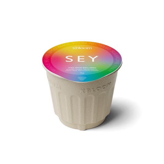 xBloom x SEY coffee xPod with colorful lid on a white background