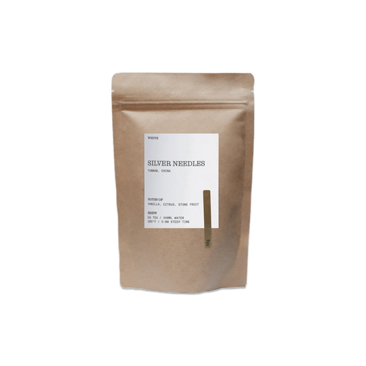 Kraft paper tea bag with a label on a white background