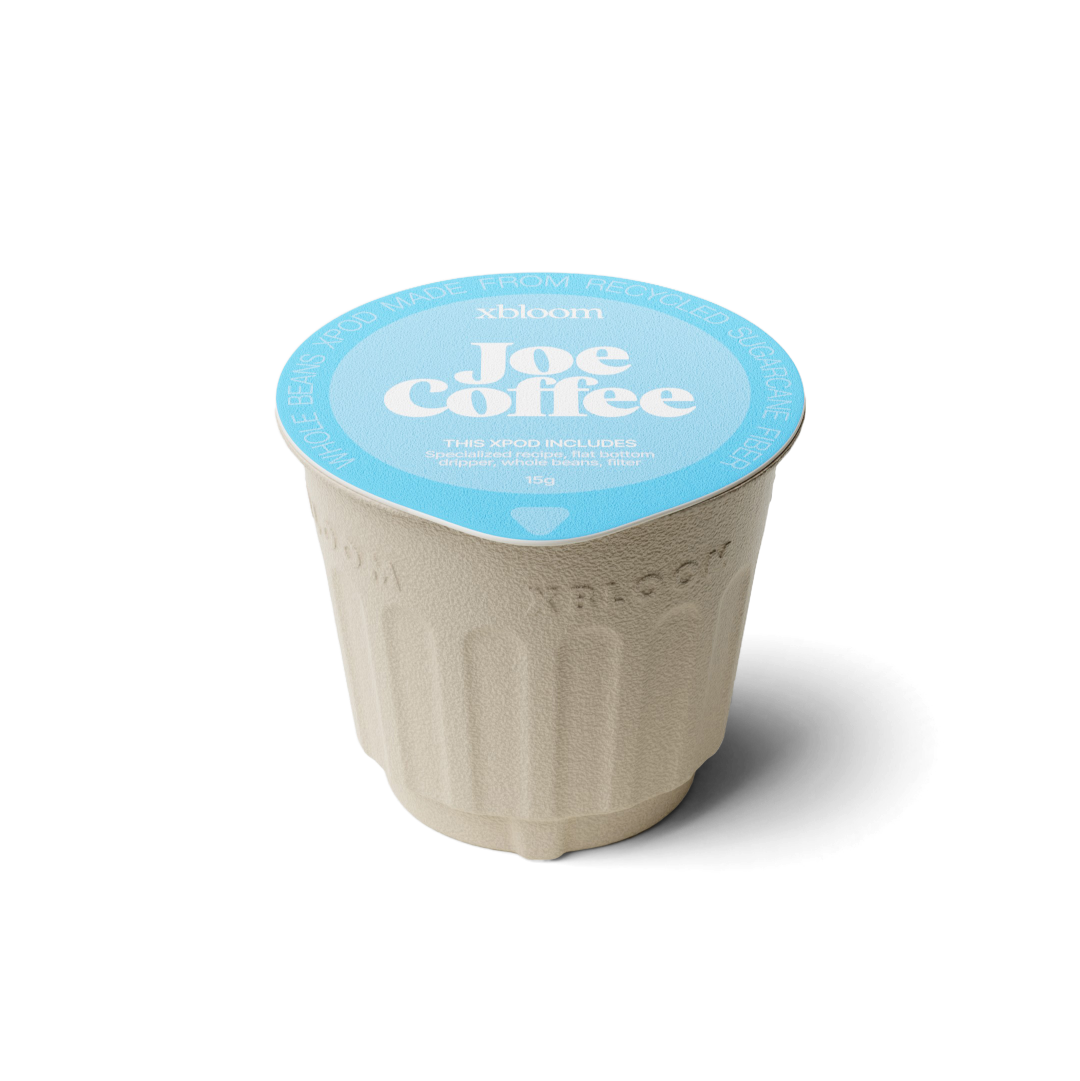 xBloom x Joe Coffee coffee xpod with a blue llid on a white background