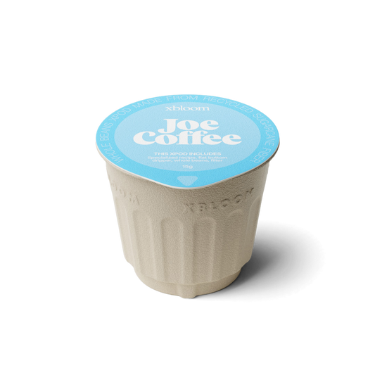 xBloom x Joe Coffee coffee xpod with a blue llid on a white background