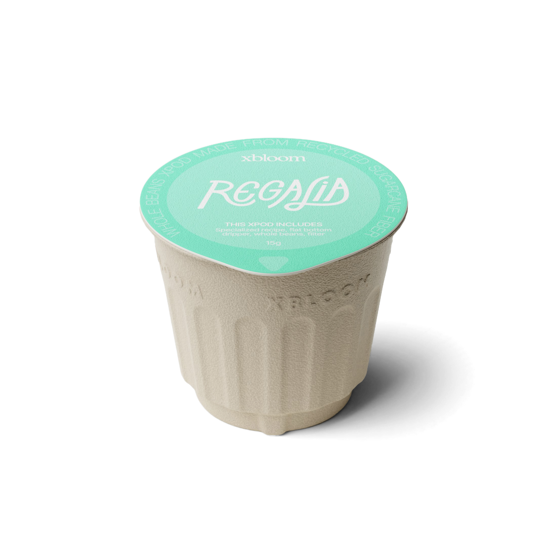 xBloom x Regalia coffee pod with green lid on a white background