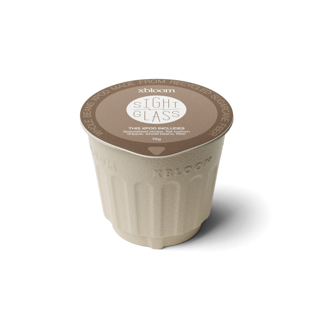 xBloom x Sight Glass coffee pod on a white background