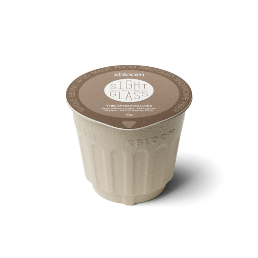 xBloom x Sight Glass coffee pod on a white background